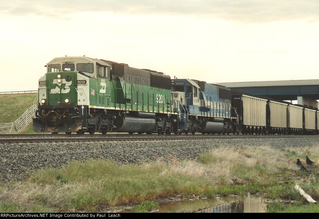 Loaded coal train rolls west